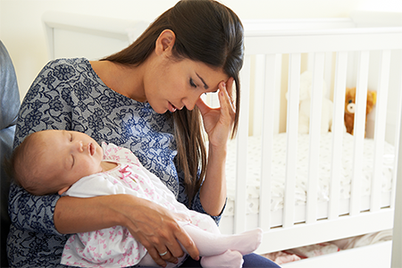 exhausted-mom-holding-baby-450x300